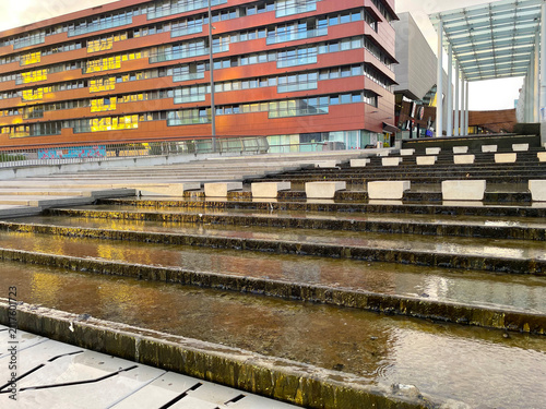 The modern city of Almere in a bright blue cloudy sky, at sunset  Almere, Flevoland, the Netherlands, July, 2026