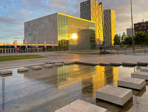 The modern city of Almere in a bright blue cloudy sky, at sunset  Almere, Flevoland, the Netherlands, July, 2026