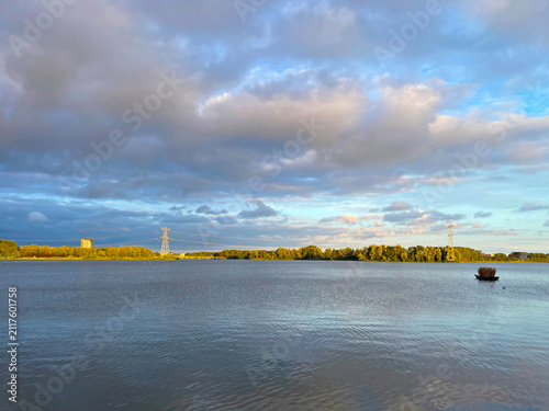 The modern city of Almere in a bright blue cloudy sky, at sunset  Almere, Flevoland, the Netherlands, July, 2026