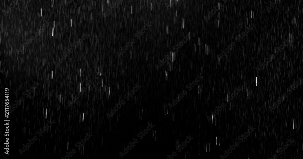 Obraz premium Realistic rain streaks isolated on a black background creating a realistic weather overlay with dynamic falling droplets perfect for visual effects compositing graphic design.