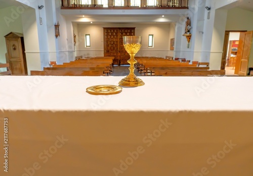 Konstfotografi Golden chalice and paten on altar in chapel