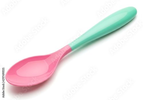Pink and mint green baby spoon on plain background
