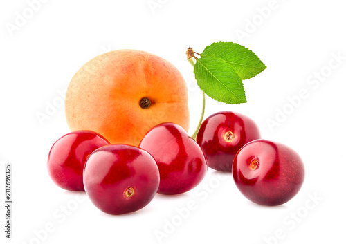 Sweet cherries with apricot isolated on white background cutout. Ripe berries closeup.