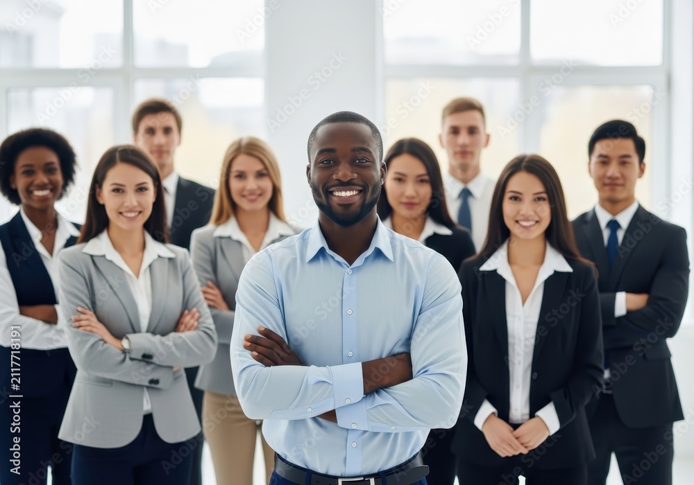 Fototapeta premium Confident African American Leader Standing with Diverse Professional Business Team in Modern Office Environment