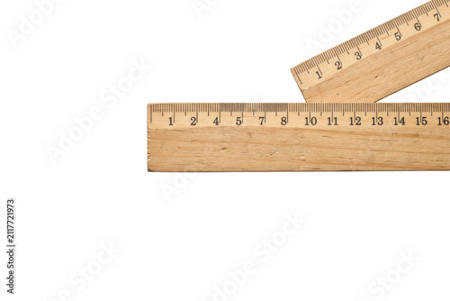 Two wooden rulers forming a right angle on white background
