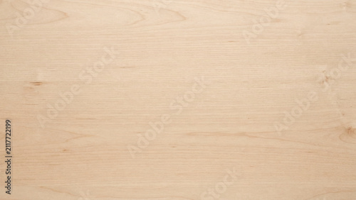 Light beige plywood surface with natural wood grain texture and horizontal patterns background
