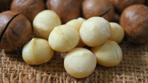 Roasted macadamia nuts with a golden brown colour and crunchy texture. Premium healthy snack rich in healthy fats and nutrients, ideal for healthy eating, baking, cooking, and food photography concept