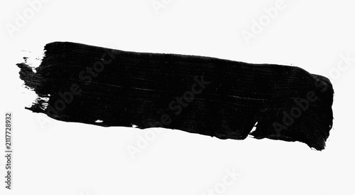 Top view a vibrant brush stroke black color paint  isolated white background for artistic graphic design. wallpaper, illustration, light, grunge, brushstroke ink texture