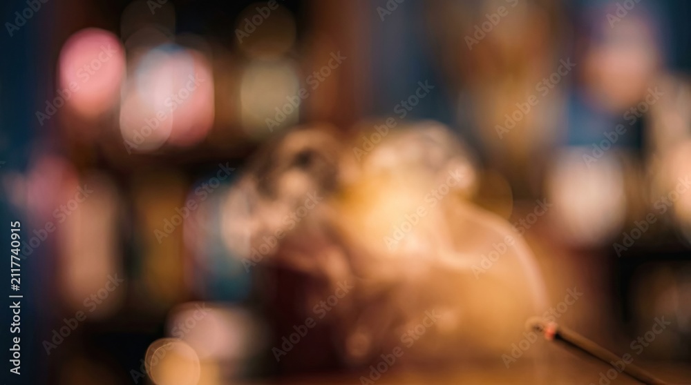 Naklejka premium Abstract Bokeh Lights Background with Incense Smoke and Subtle Blurry Shapes