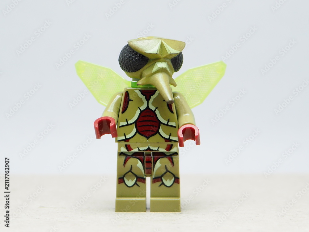 Fototapeta premium Indonesia - December 10, 2025 : Mini toy of action figure at outdoor with blurred background. Miniature photography concept design. Minifigure of Green insect Mosquito character.