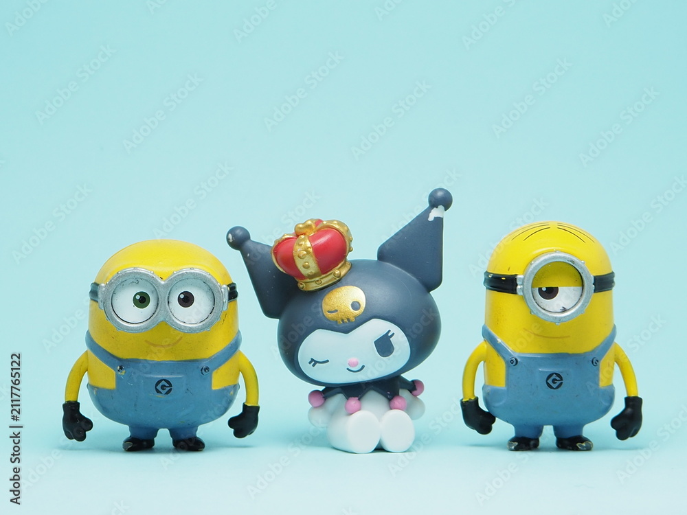 Fototapeta premium Indonesia - November 3, 2025 : Mini toy of action figure at outdoor with blurred background. Miniature photography concept design. Minions character from Despicable Me Cartoon film and Kuromi Sanrio.