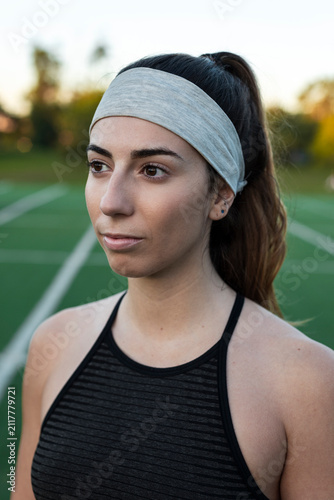Contemplative athlete holding quiet focus on field