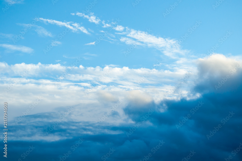 Fototapeta premium Blue evening sky with colorful clouds, dramatic sunset cloudscape