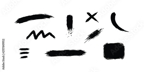 Foto Set of black ink brush strokes and artistic shapes for creative design projects