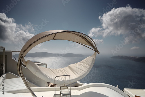 Santorini island. Romantic white chairs on white caldera with sea view. Luxury travel and vacation destination. Amazin