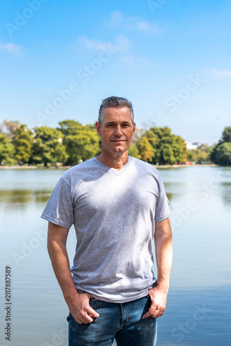 Принти на полотні Authentic portrait of an attractive middle aged man outdoors