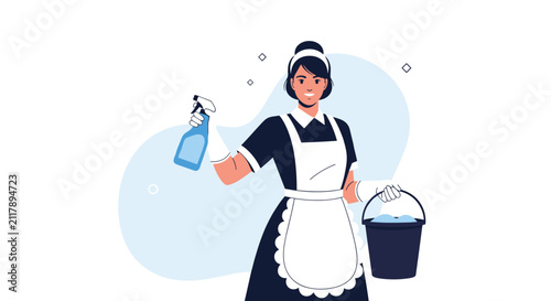 Cheerful professional housemaid or cleaning lady in uniform holding a water spray bottle and a soapy water bucket.