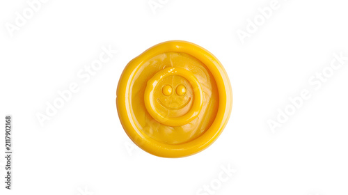 Small yellow smiley coin nested in ring on black background
