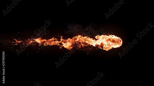 Foto A bright horizontal trail of fire flames isolated on a deep black background for