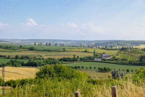 Fotografía Summer landscape, The terrain of hilly countryside, A hamlet on hillside with gr