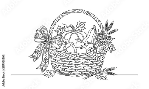 Bild auf Leinwand Basket filled with autumn harvest vegetables and fruits with decorative ribbon i