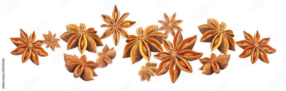 Obraz premium Aromatic star anise spice flying in dynamic composition, isolated on transparent cutout background