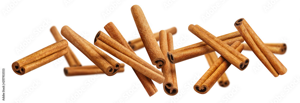 Obraz premium Natural rolled cinnamon spice scattered in weightless motion, isolated on transparent cutout background