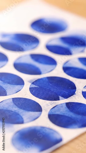 Blue circles on white surface, abstract background
