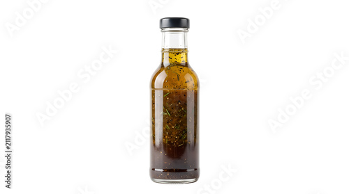 Photography Glass bottle of balsamic vinaigrette salad dressing with herbs and oil