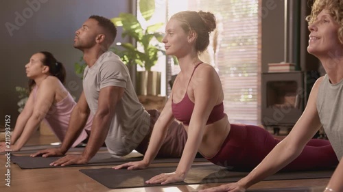 Yoga class group during lesson at gym