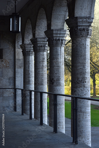 Stone pillars row and stairs detail. Building facade in a classical style