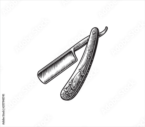 Vintage straight razor with ornate handle and blade  shaving tool