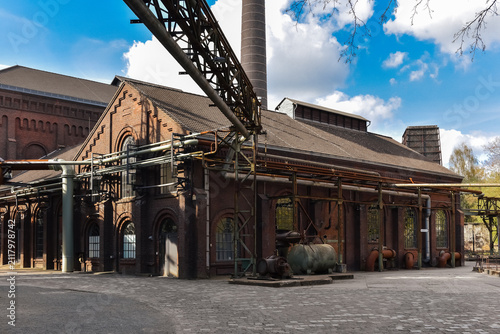 An old, abandoned factory with pipes and valves