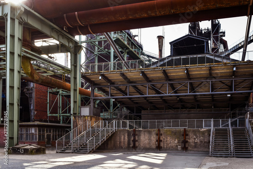 Abandoned factory. Large, empty, ruined workshop with remnants of equipment