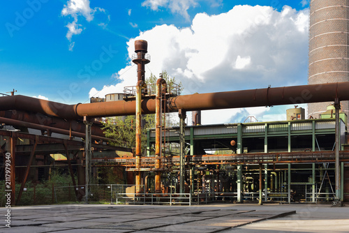 Old, rusty, abandoned factory with remnants of equipment