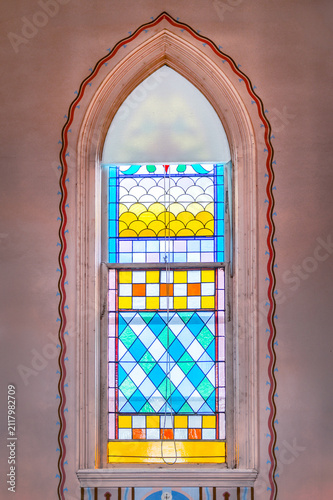 Arched Stained Glass Window in 152 Year Old Catholic Church