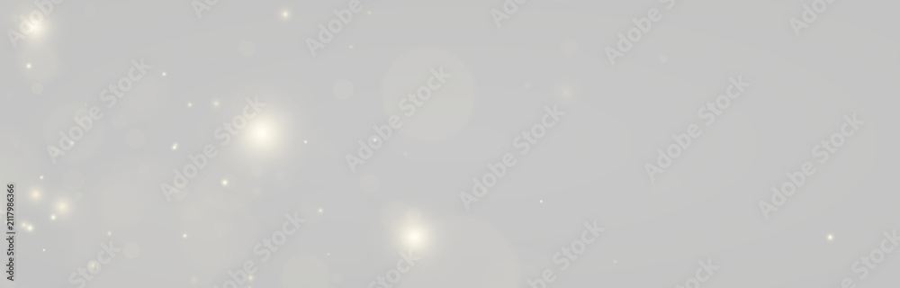 Fototapeta premium Magical gold sparkles float among luminous particles. Warm glowing highlights create an elegant dreamy atmosphere. Perfect for wedding invitations, banners, and festive artwork.