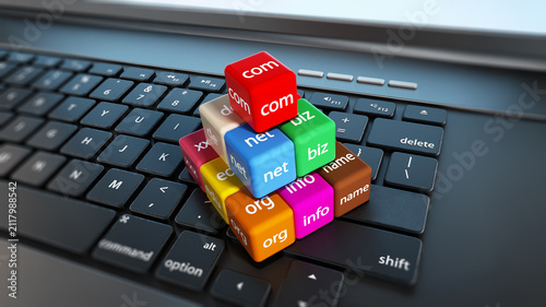 Foto Domain name cubes standing on laptop computer keyboard