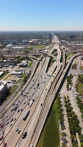 Complex freeway interchange in Uptown Houston, Texas with elevated roads, bridges and city infrastructure defining modern American metropolis.
