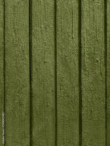 Obraz na płótnie Old painted wooden door texture in olive green with grooved panels weathered rus