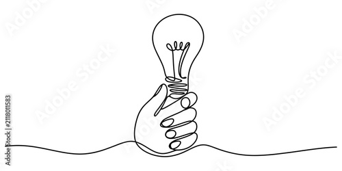Foto A hand holding a light bulb drawn in a single continuous line style representing