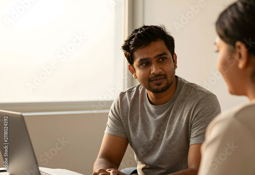 Young Indian man in a gray ...