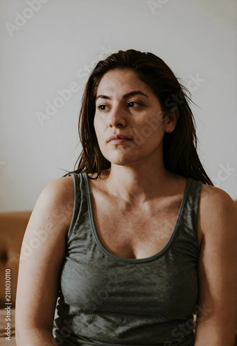 Thoughtful young adult woma...