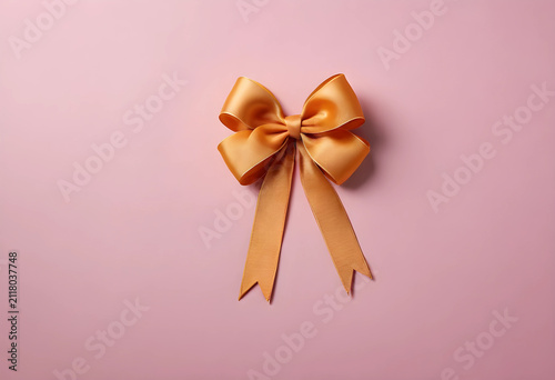 Golden satin gift bow with ...