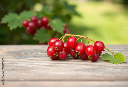Fresh red currants on a rus...