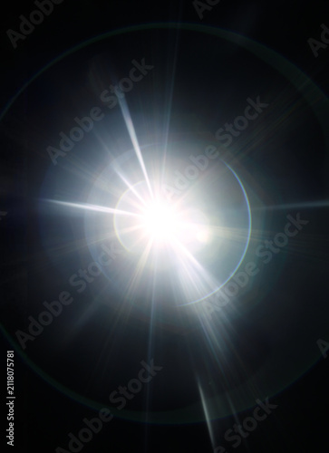 Obraz na płótnie warm light beam flare on black background, dazzling radiance