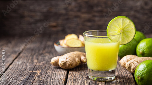 Fotografie Fresh lime juice and ginger shots for immunity boost