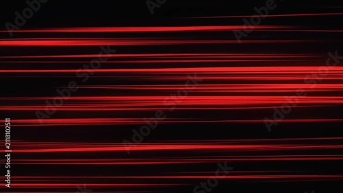 Red abstract light streaks moving horizontally on black background