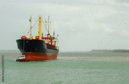 Cargo ship assisted by tugboat at Port of Cabedelo, Paraíba, Brazil November 24, 2004