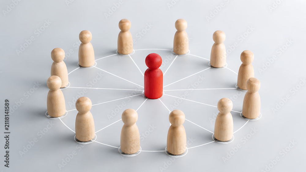 Obraz premium Diverse Wooden Figures Connected in a Network with a Red Leader Standing Out in the Center
